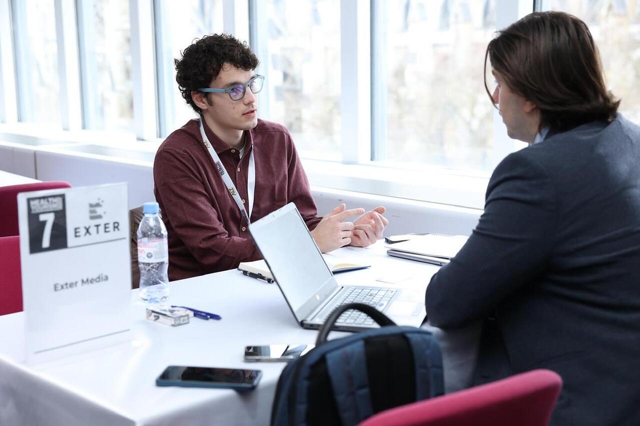 Exter Media team member in a client meeting at a business event
